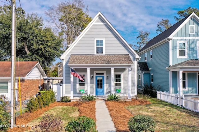 bungalow with a porch and a front yard