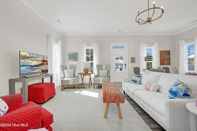 living room featuring ornamental molding, dark wood-type flooring, and a chandelier