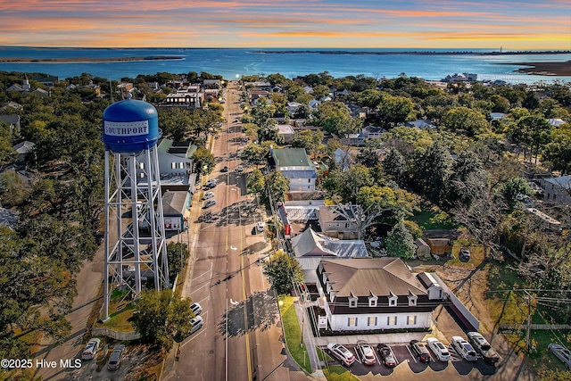 aerial view at dusk with a water view