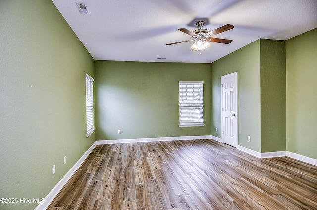 unfurnished room featuring ceiling fan and light hardwood / wood-style floors