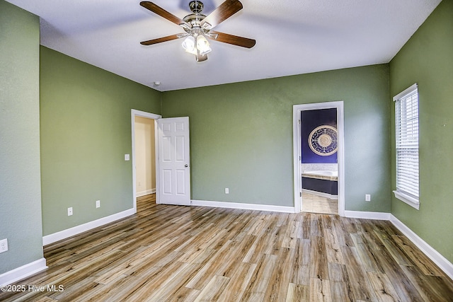 interior space with ceiling fan and light hardwood / wood-style floors