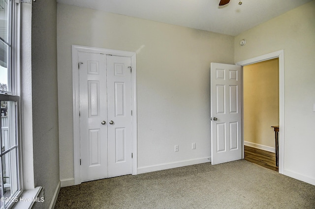 unfurnished bedroom featuring a closet and carpet