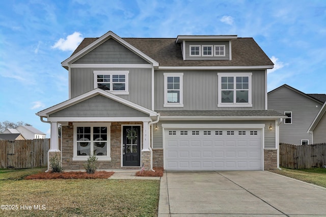 craftsman-style house with a garage, a porch, and a front yard