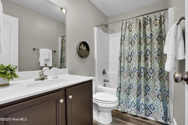 bathroom featuring hardwood / wood-style flooring, vanity, and toilet