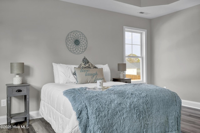 bedroom featuring dark hardwood / wood-style floors