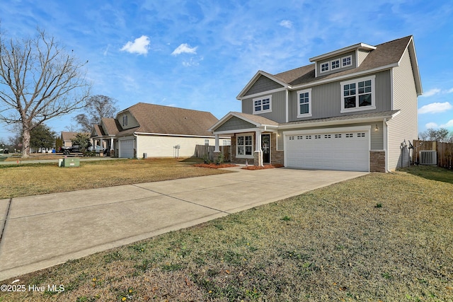 view of front of property with a garage, central AC, a front yard, and covered porch