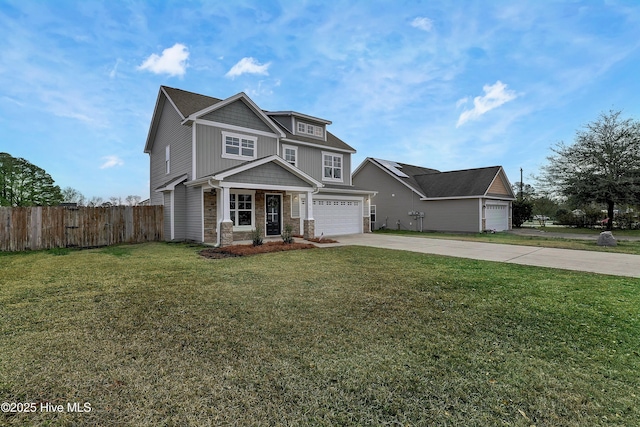 view of front of home featuring a garage and a front yard