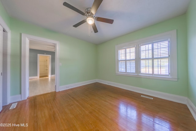 unfurnished room with light hardwood / wood-style floors and ceiling fan