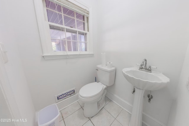 bathroom with tile patterned floors and toilet