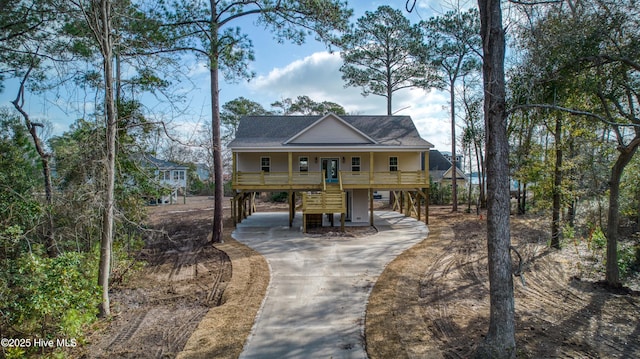 beach home with a carport and a porch