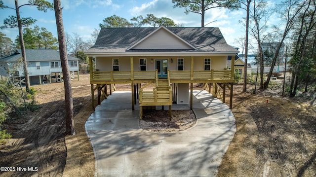 view of front of home featuring a carport and covered porch