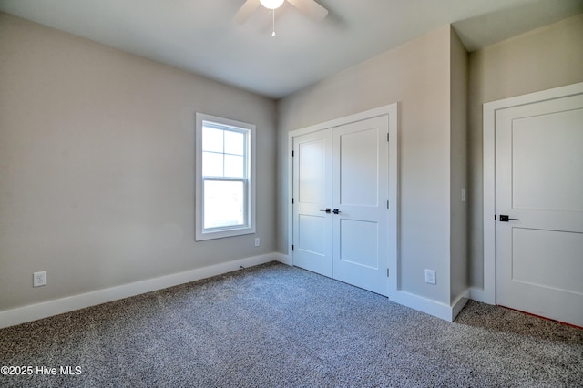 unfurnished bedroom featuring a closet, carpet flooring, baseboards, and a ceiling fan