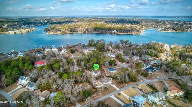 drone / aerial view featuring a residential view and a water view