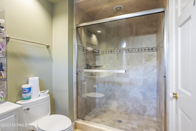 bathroom with toilet and walk in shower