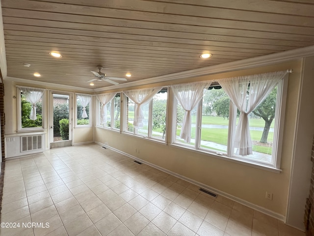 unfurnished sunroom with wooden ceiling and ceiling fan