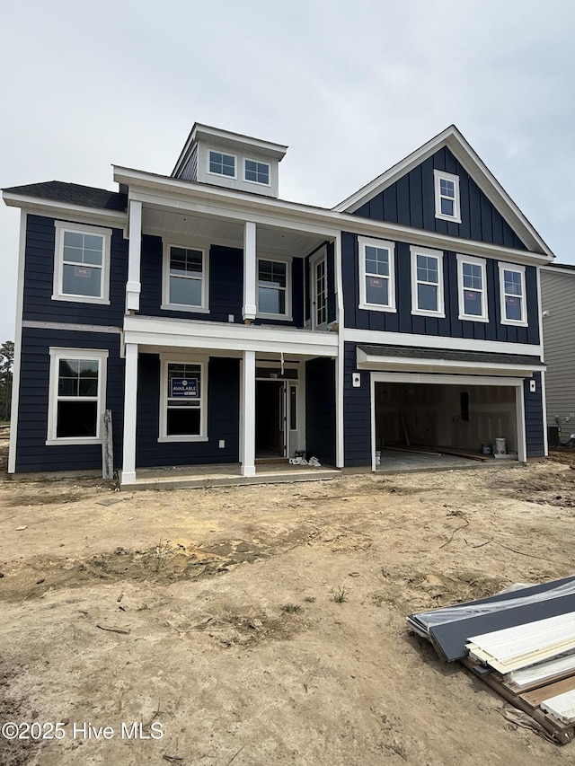 1024 Peace St Lot 73, Leland, NC 28451 - view of front of house with covered porch, board and batten siding, and a garage