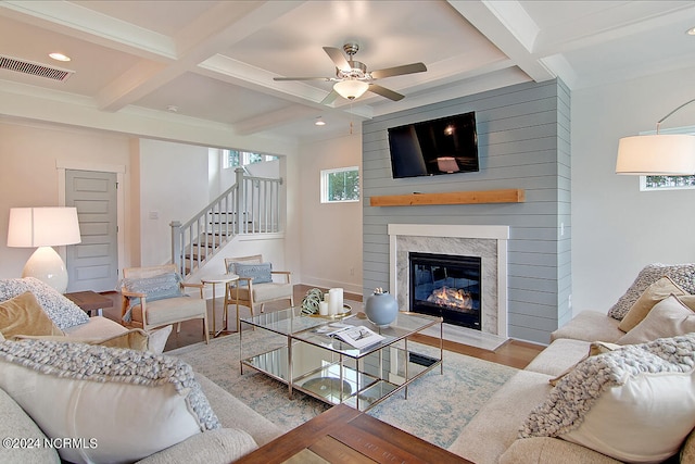 1024 Peace St Lot 73, Leland, NC 28451 - living room featuring coffered ceiling, stairs, beam ceiling, a fireplace, and a ceiling fan