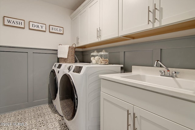 1024 Peace St Lot 73, Leland, NC 28451 - laundry room featuring a decorative wall, separate washer and dryer, cabinet space, and wainscoting
