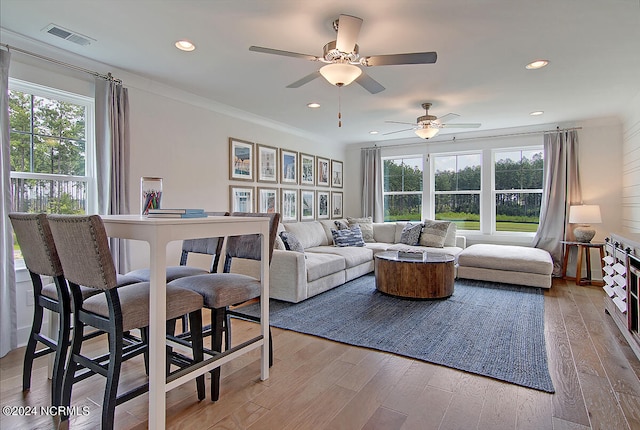 1024 Peace St Lot 73, Leland, NC 28451 - living room with healthy amount of natural light, ceiling fan, light wood-type flooring, recessed lighting, and crown molding
