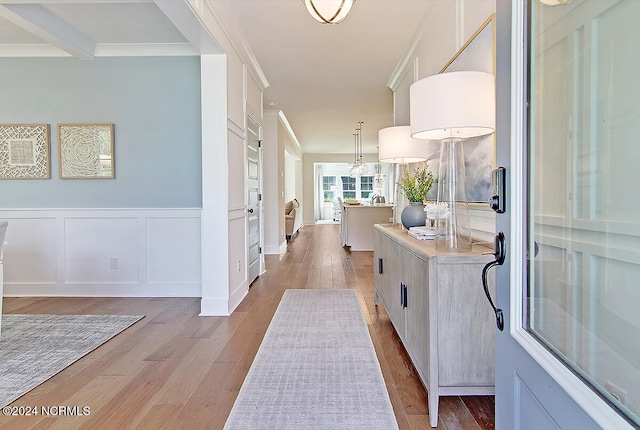 1024 Peace St Lot 73, Leland, NC 28451 - hallway featuring wood finished floors, a decorative wall, wainscoting, and ornamental molding