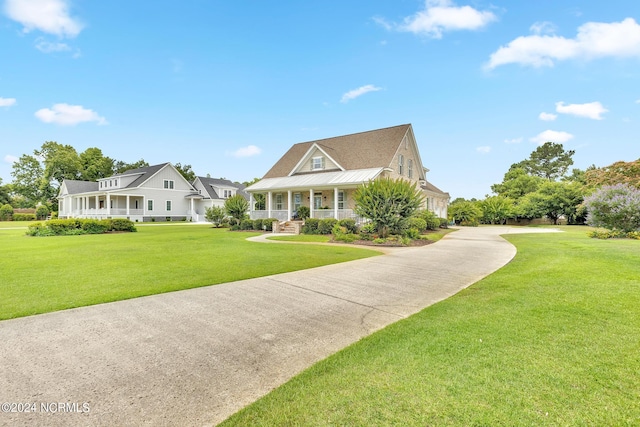 view of front of property with a porch and a front yard