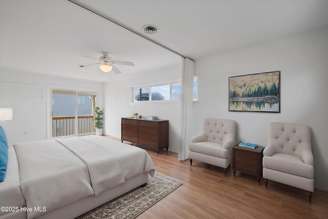 bedroom with ceiling fan and light hardwood / wood-style floors