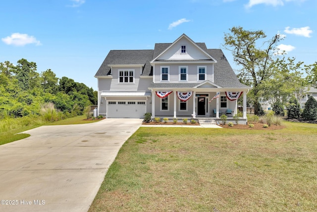 view of front facade featuring a garage, a front lawn, and covered porch