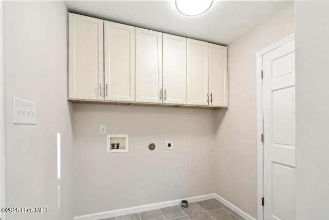 laundry room featuring cabinets, electric dryer hookup, washer hookup, and light tile patterned floors