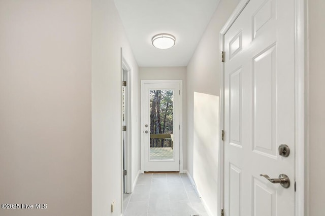 hallway featuring light tile patterned flooring