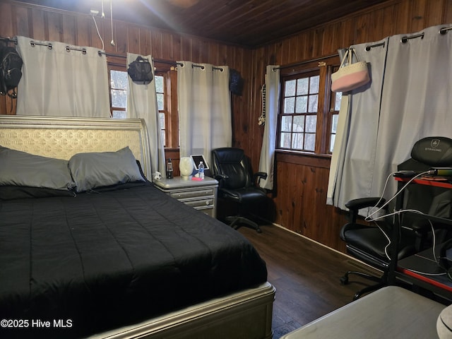 bedroom featuring dark wood-type flooring, wooden walls, and wooden ceiling