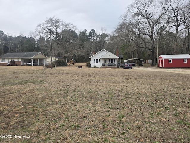 view of yard with covered porch