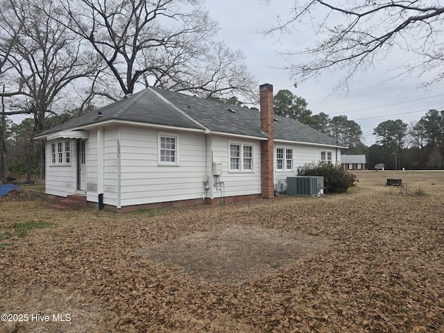 rear view of property featuring central AC unit