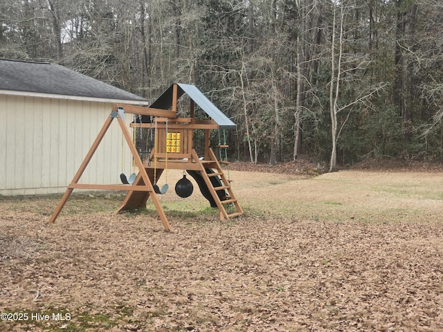 view of playground with a lawn