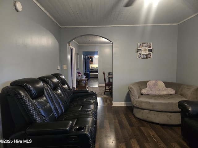 living room featuring dark wood-type flooring, ornamental molding, and wooden ceiling