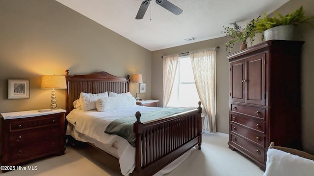 carpeted bedroom with lofted ceiling and ceiling fan