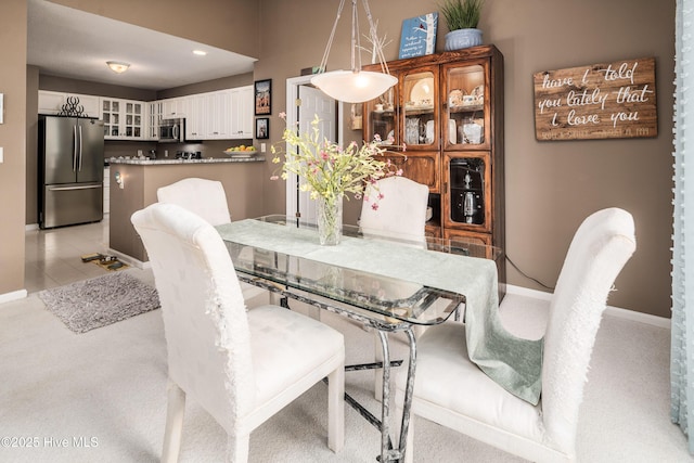 dining area with light colored carpet