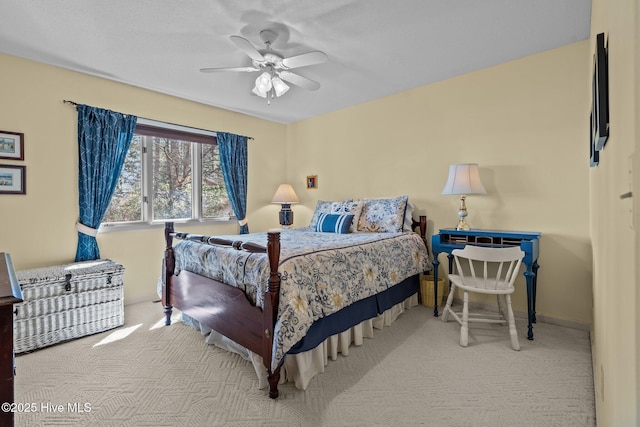 bedroom featuring carpet, baseboards, and a ceiling fan