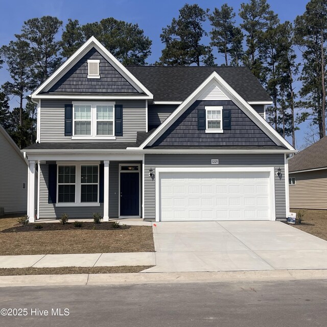 craftsman house featuring a garage, a front yard, and central air condition unit