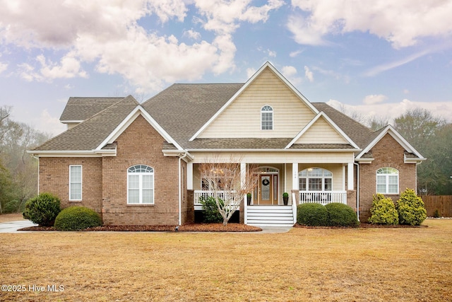 view of front facade with a front lawn and covered porch