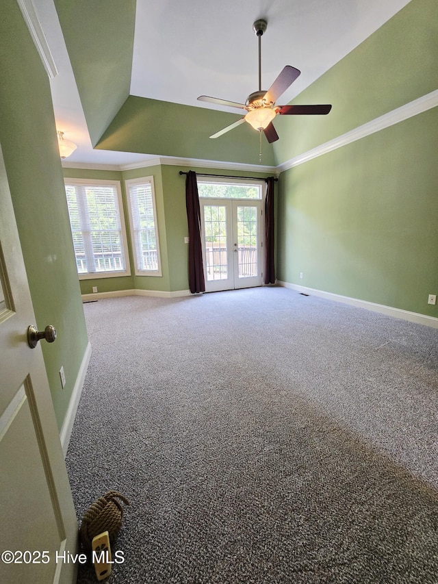 108 Casey Ct, Cedar Point, NC 28584 - carpeted spare room with baseboards, a ceiling fan, a tray ceiling, ornamental molding, and french doors
