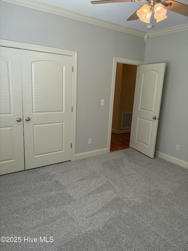 108 Casey Ct, Cedar Point, NC 28584 - unfurnished bedroom featuring crown molding, carpet, baseboards, a ceiling fan, and a closet
