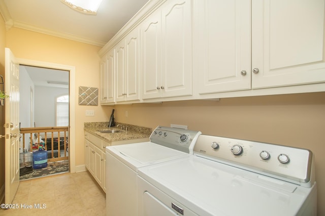 108 Casey Ct, Cedar Point, NC 28584 - laundry room featuring washing machine and dryer, cabinet space, crown molding, and light tile patterned floors