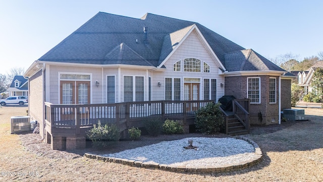 108 Casey Ct, Cedar Point, NC 28584 - rear view of property with a deck, central air condition unit, and a shingled roof