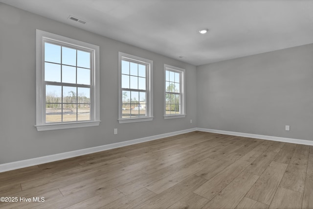 unfurnished room featuring light wood-type flooring