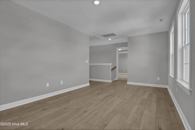 spare room featuring light wood-type flooring