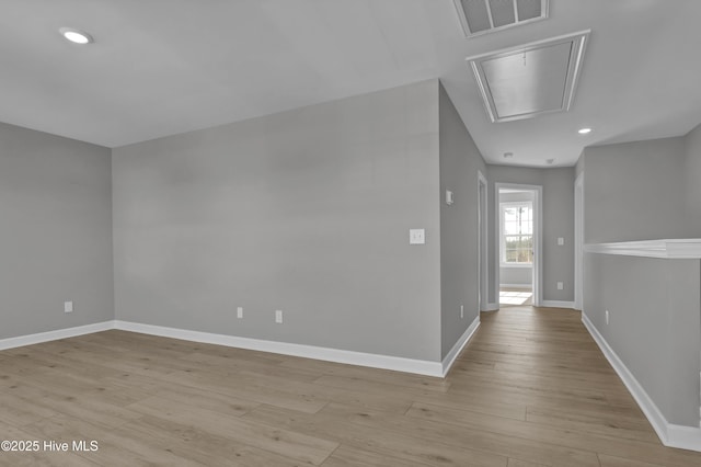 hallway with light hardwood / wood-style flooring