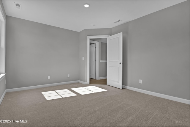 unfurnished bedroom featuring light colored carpet