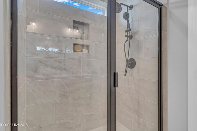 bathroom featuring a shower stall