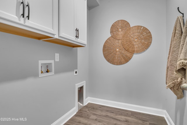 laundry area with washer hookup, wood finished floors, baseboards, cabinet space, and electric dryer hookup