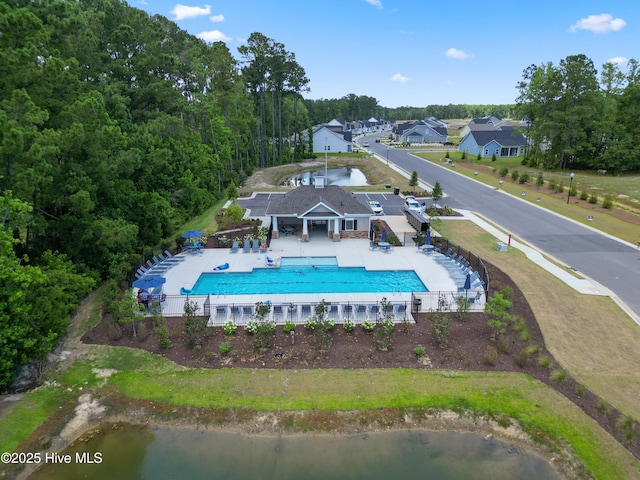 pool featuring fence and a patio